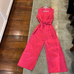 Hot pink pants romper, size medium but fits like small.